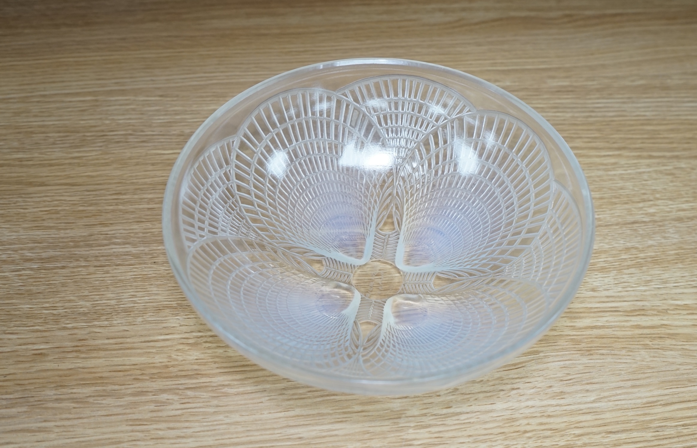 An R. Lalique coquille pattern glass bowl, no.3201, 21cm diameter. Condition - wear to base as expected, otherwise good